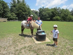 Grandpa leading horse to water during the ring ride.